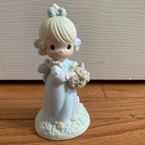 Precious Moments, smell the flowers